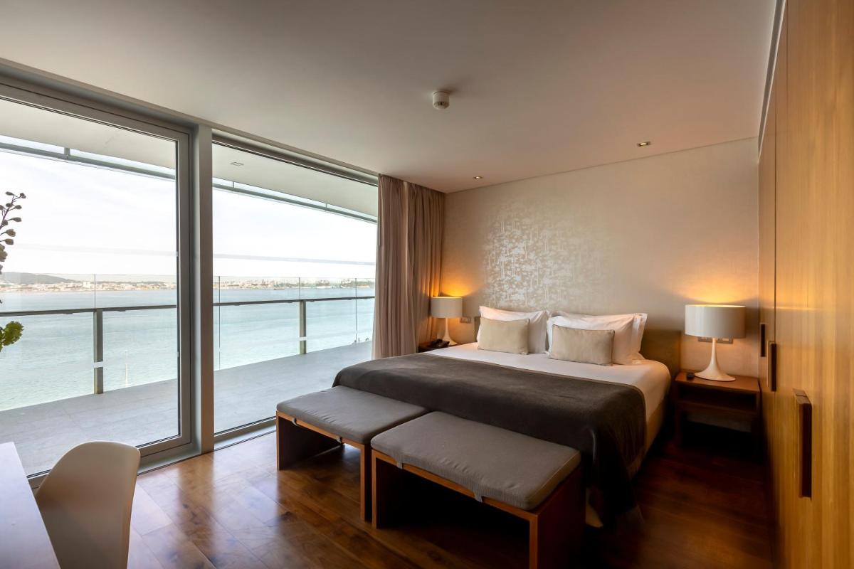 Uma cama ou camas num quarto em Troia Design Hotel
