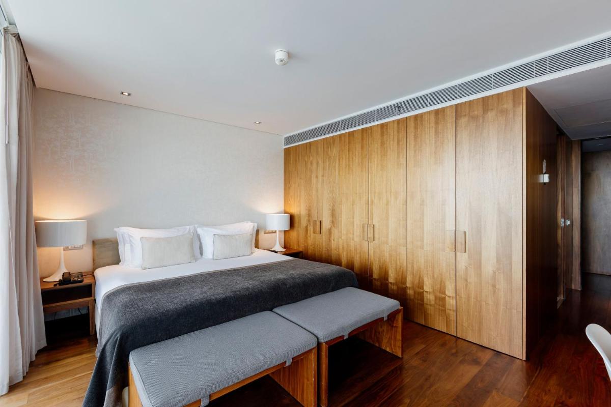 Uma cama ou camas num quarto em Troia Design Hotel