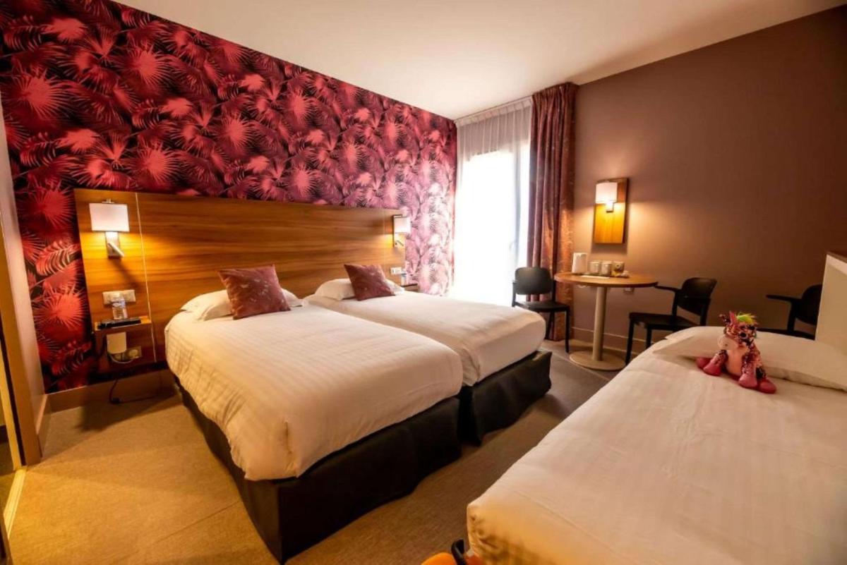 Un ou plusieurs lits dans un hébergement de l'établissement Best Western Eden SPA
