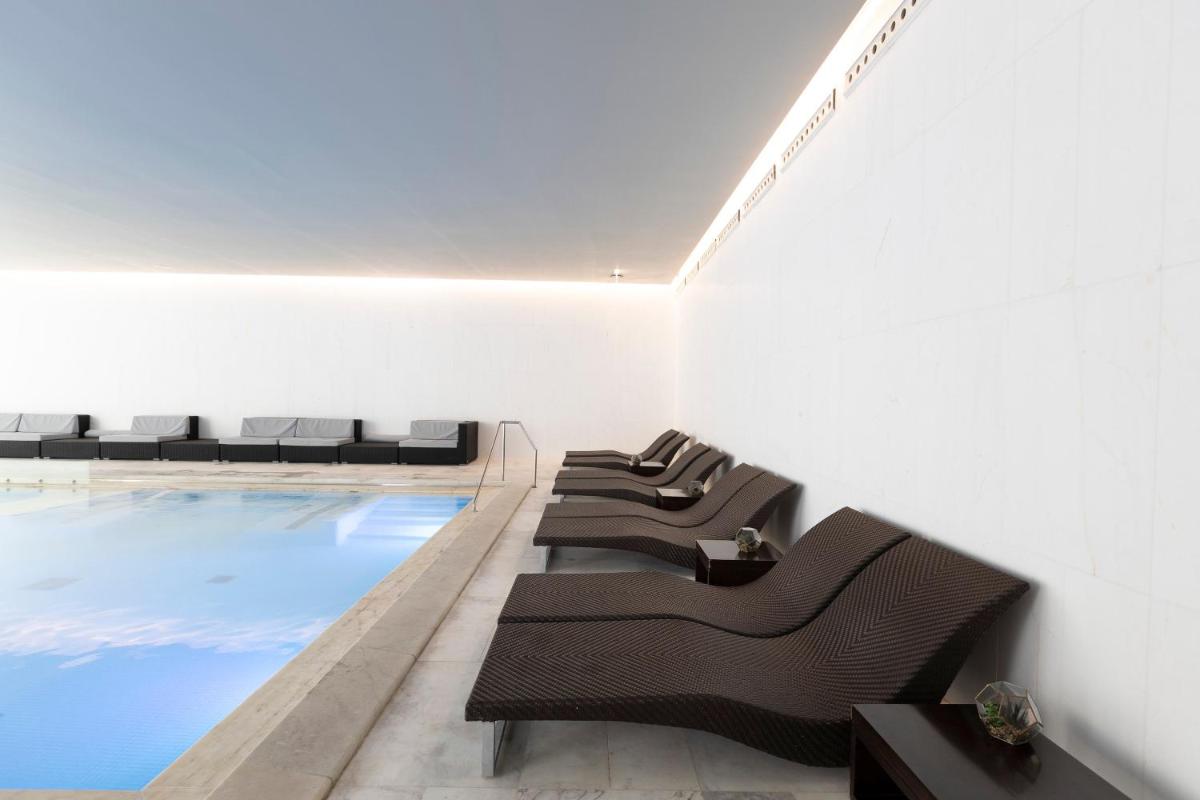 Uma área de estar em Troia Design Hotel