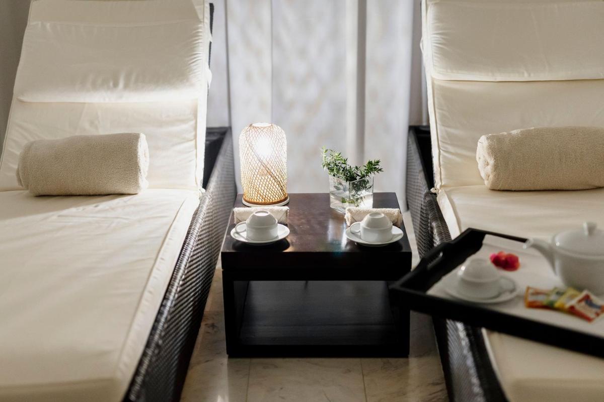 Uma cama ou camas num quarto em Troia Design Hotel