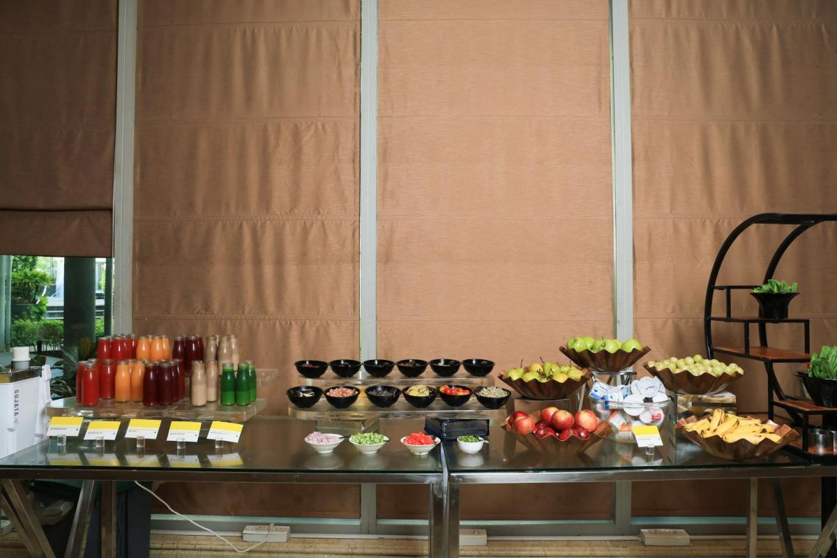 a buffet with many different types of food on a table at Le Royal Meridien Chennai in Chennai