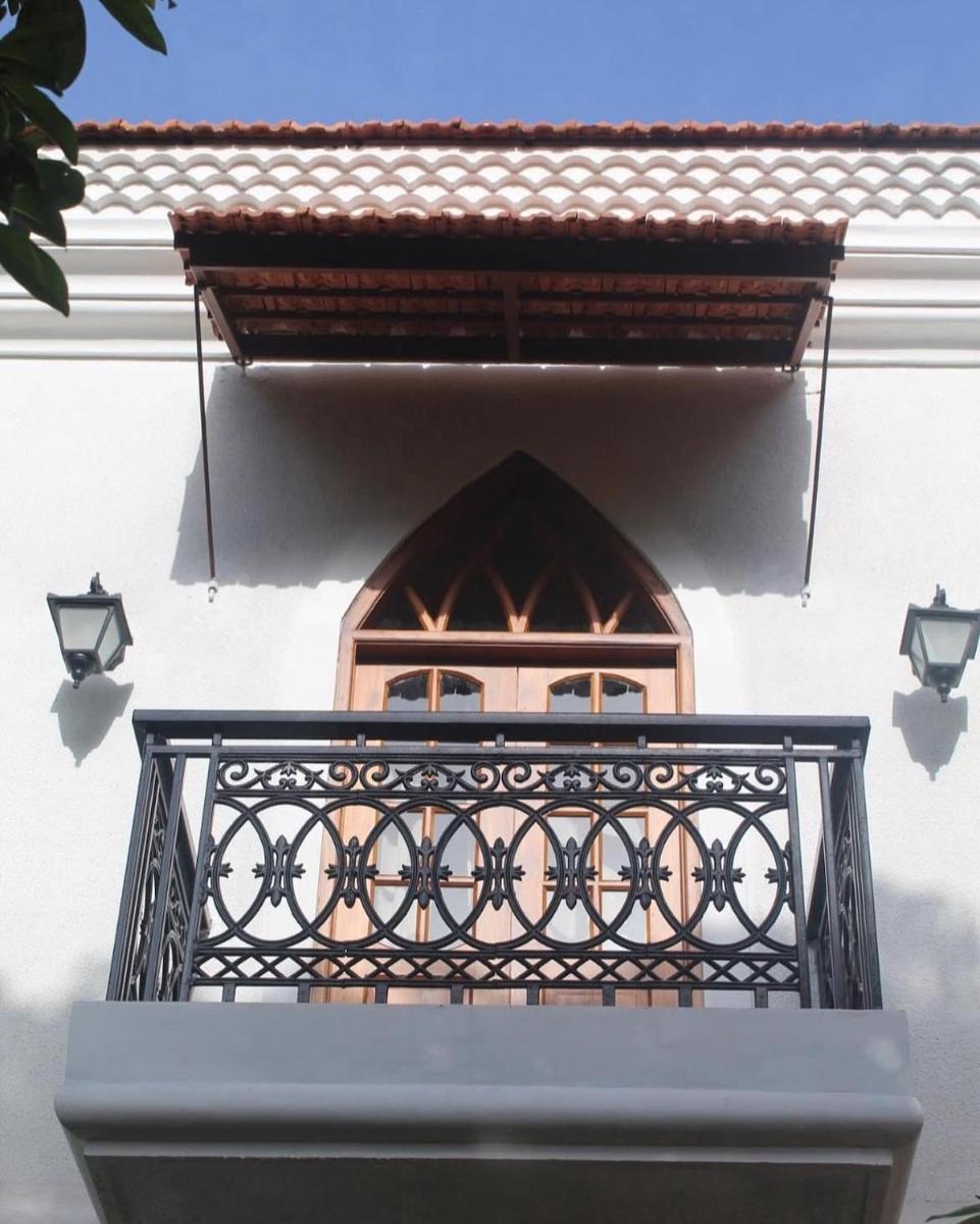 a balcony with a window on a building at The Postcard Saligao in Calangute