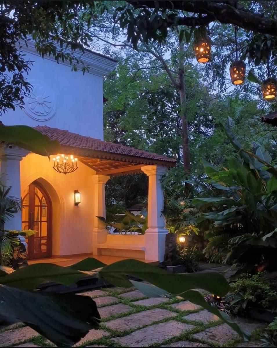 a home with a gazebo at night at The Postcard Saligao in Calangute