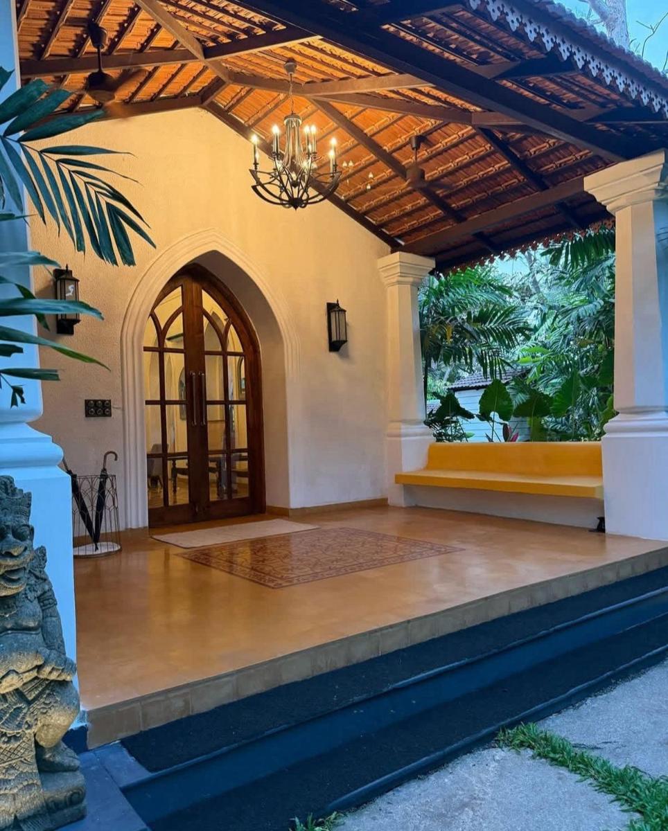 an entry to a house with a chandelier at The Postcard Saligao in Calangute