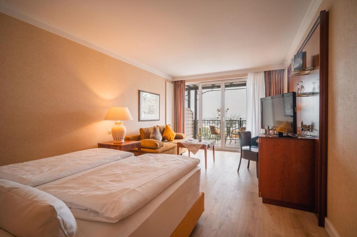 Ein Bett oder Betten in einem Zimmer der Unterkunft Grand Hotel Binz