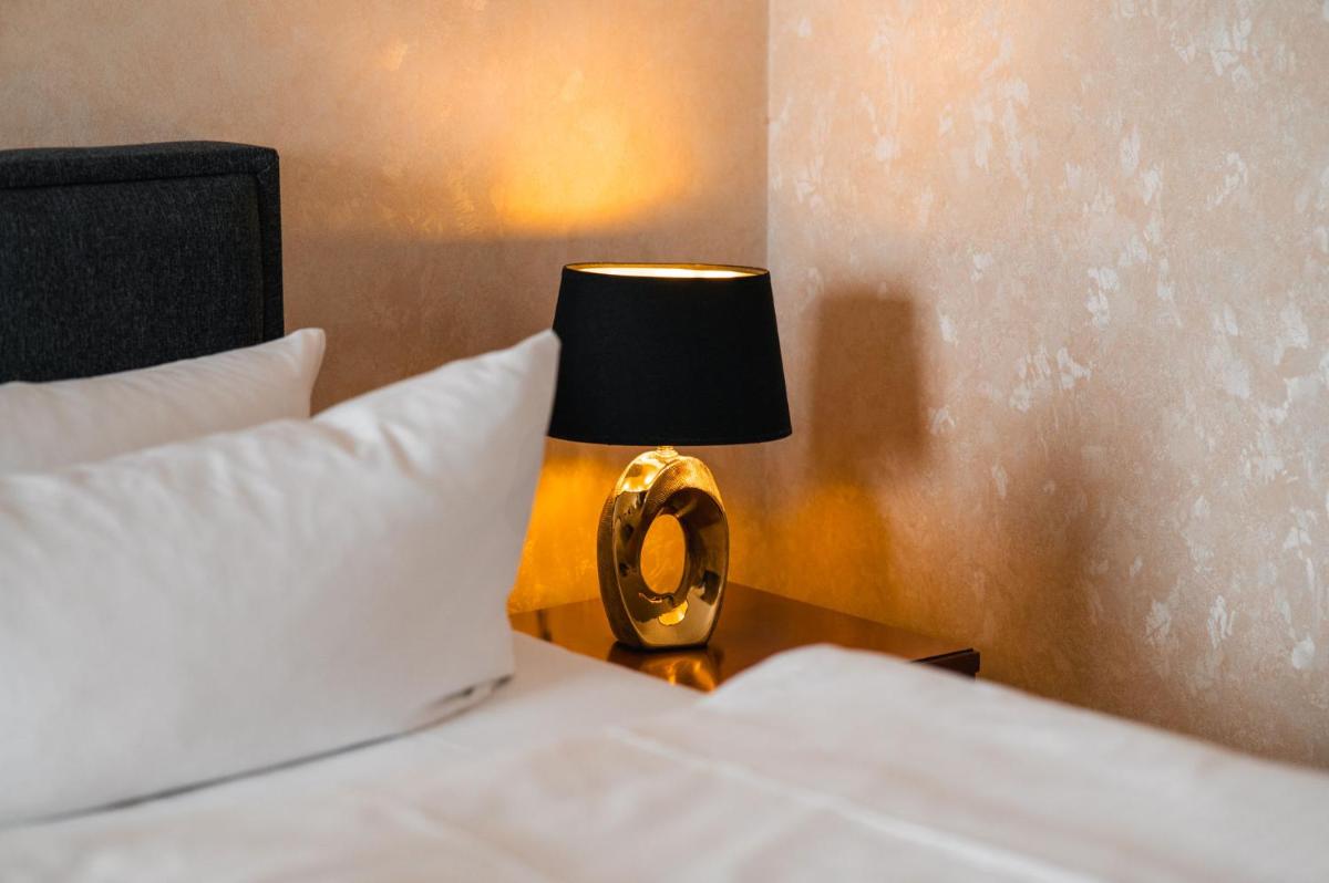 Ein Bett oder Betten in einem Zimmer der Unterkunft Grand Hotel Binz