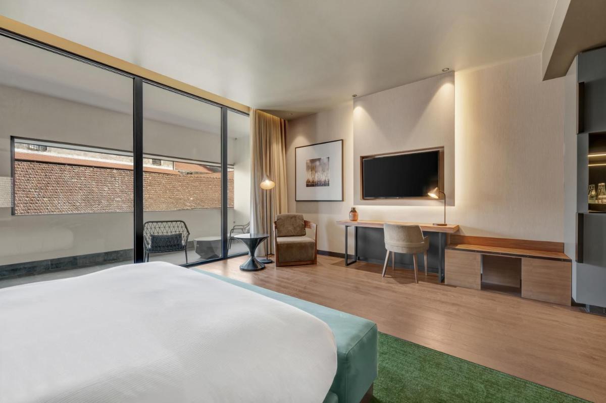 Uma televisão e/ou sistema de entretenimento em Hilton Porto Gaia