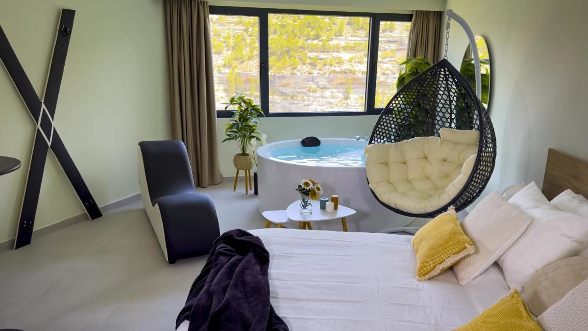 Cama o camas de una habitación en Hotel Spa Mirador