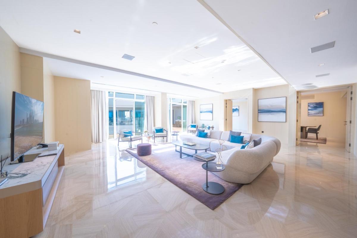 a living room with a couch and a table at FIVE Palm Jumeirah Dubai in Dubai