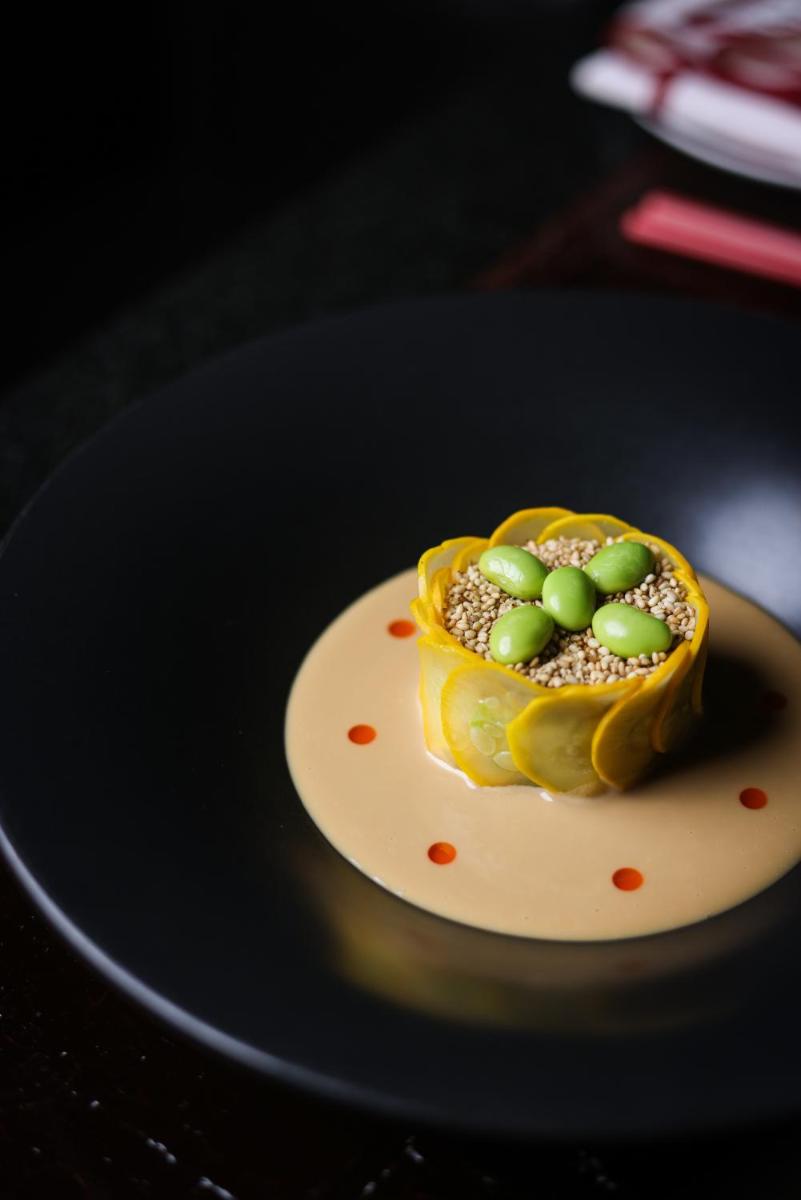 a piece of food on a plate on a table at The Leela Palace New Delhi in New Delhi a piece of food on a plate on a table at The Leela Palace New Delhi in New Delhi