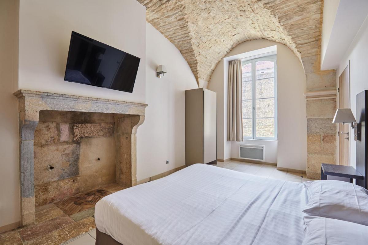 Télévision ou salle de divertissement dans l'établissement Appart'hôtel Odalys City - Dijon Centre Les Cordeliers