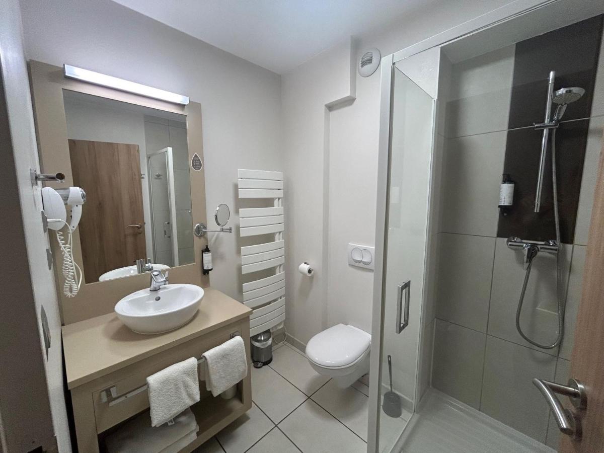 Salle de bains dans l'établissement Appart'hôtel Odalys City - Dijon Centre Les Cordeliers