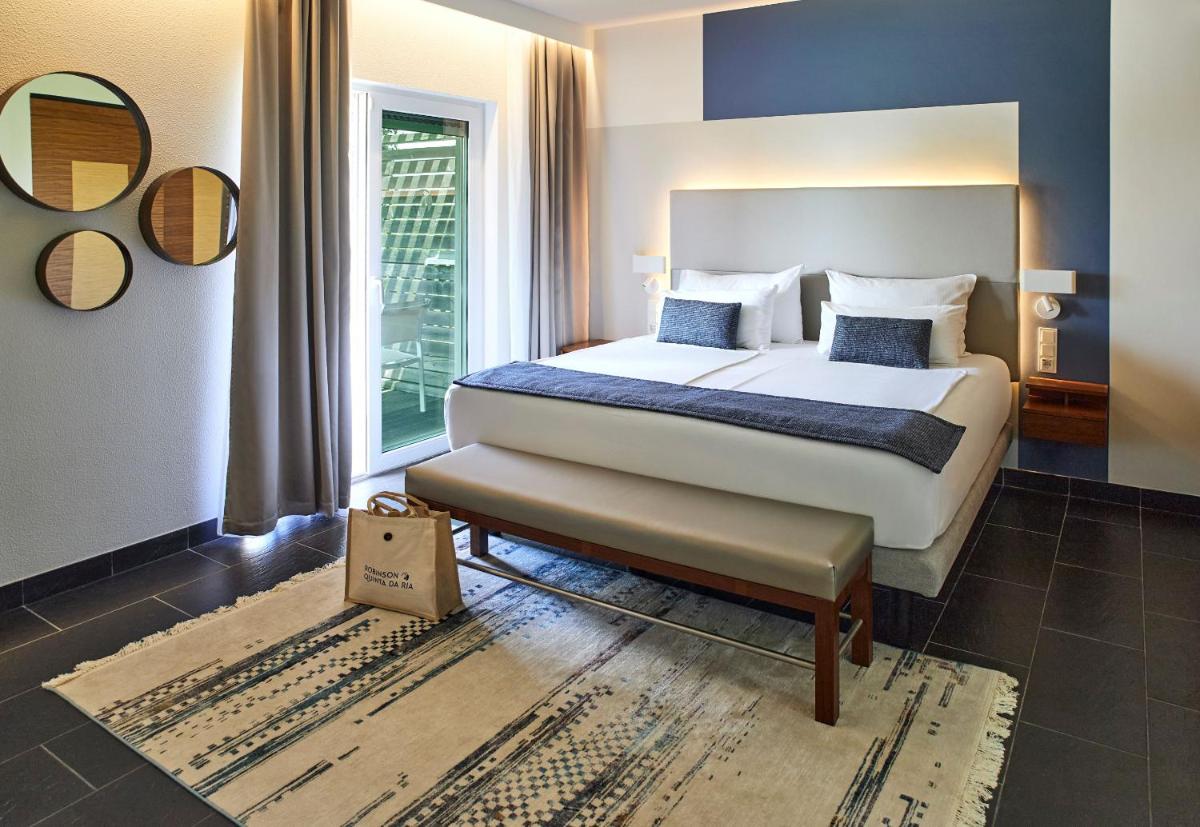 Uma cama ou camas num quarto em ROBINSON QUINTA DA RIA - All Inclusive