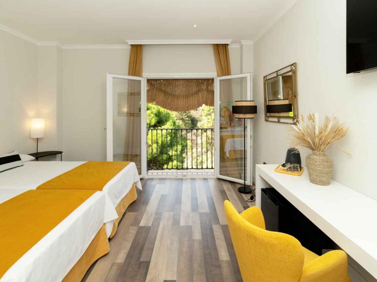 Cama o camas de una habitación en Hotel Altos de Istán