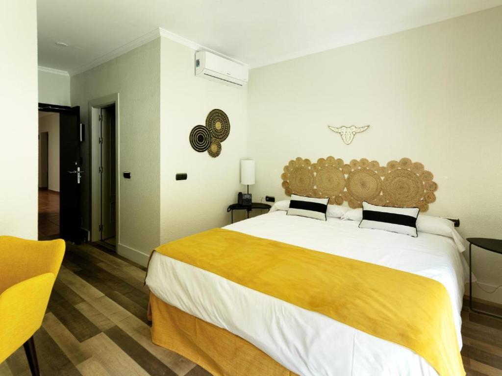 Cama o camas de una habitación en Hotel Altos de Istán