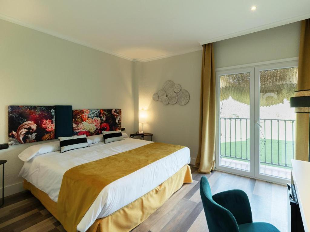 Cama o camas de una habitación en Hotel Altos de Istán