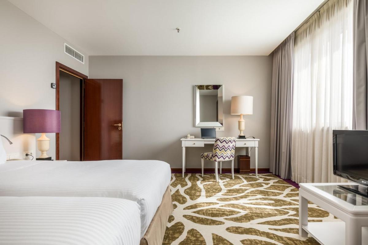 Uma cama ou camas num quarto em Holiday Inn Porto Gaia by IHG