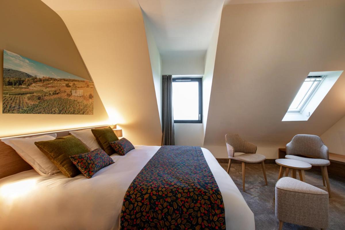 Un ou plusieurs lits dans un hébergement de l'établissement Hôtel Terra Vinum