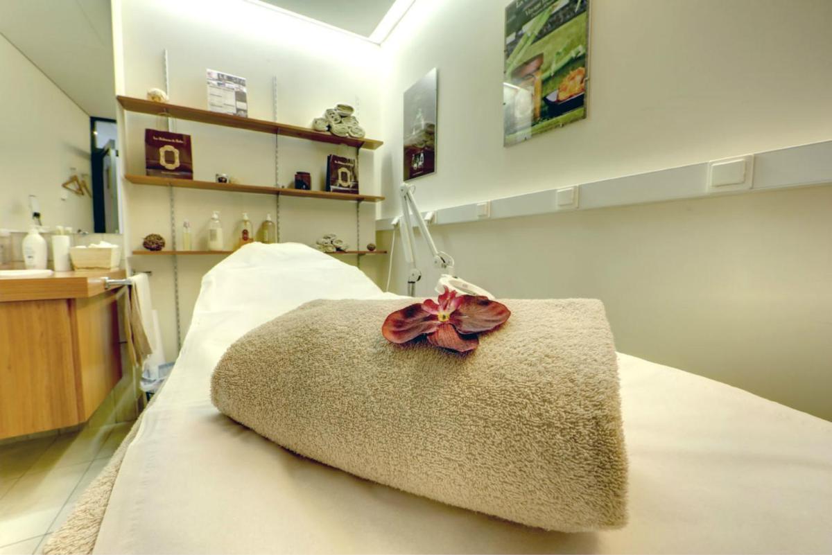 Un ou plusieurs lits dans un hébergement de l'établissement Hotel Spa Le Pasino