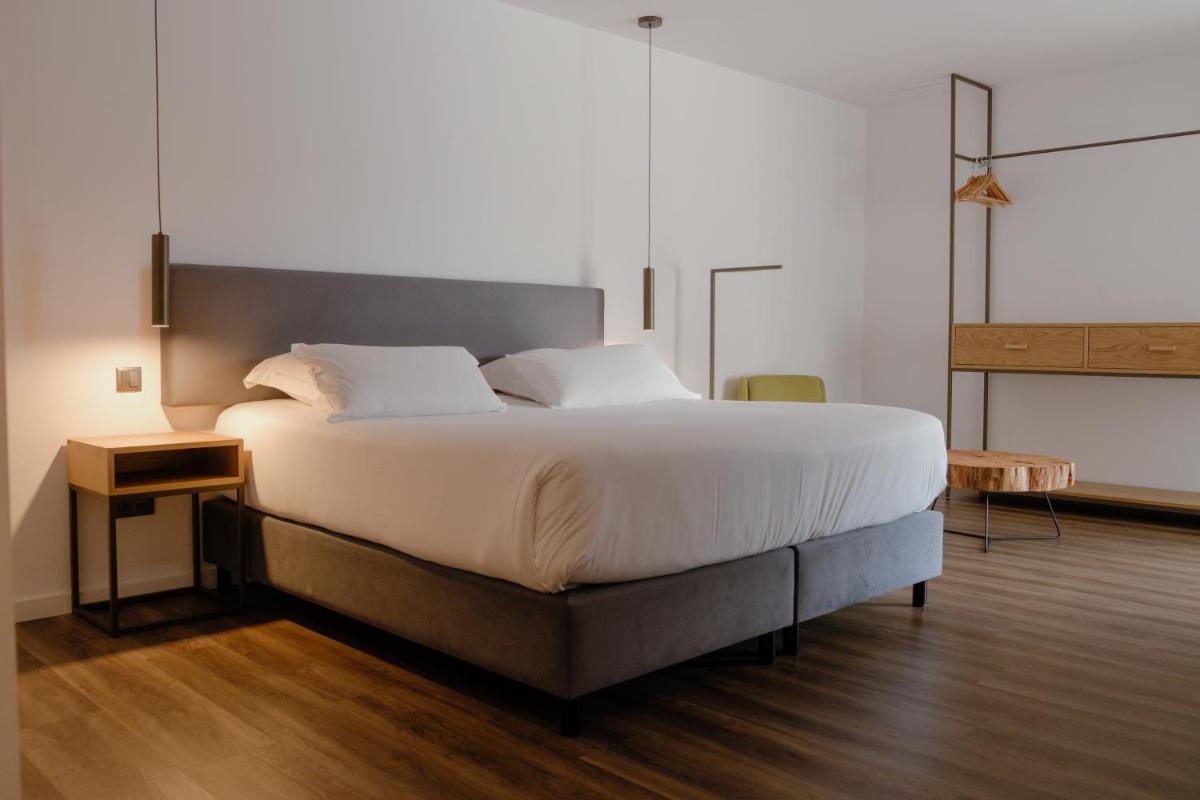 Uma cama ou camas num quarto em Monte Prado Hotel & Spa