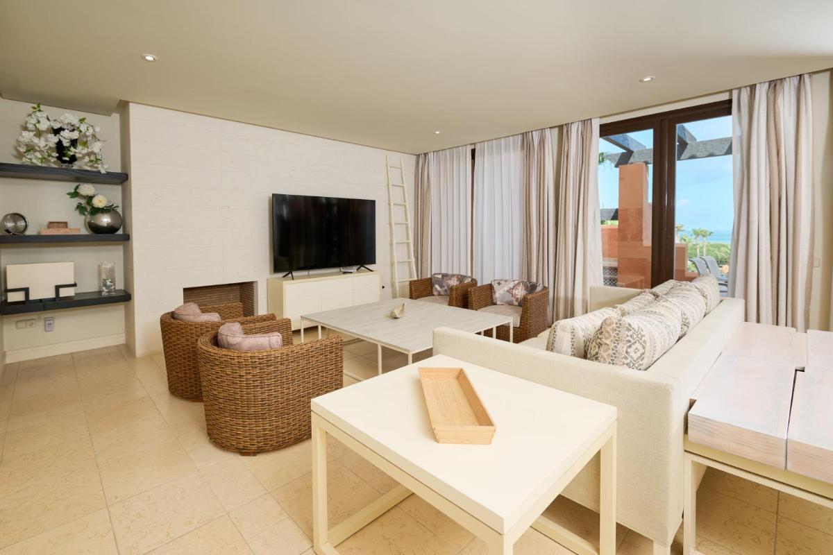 Una televisión o centro de entretenimiento en Aparthotel Novo Resort
