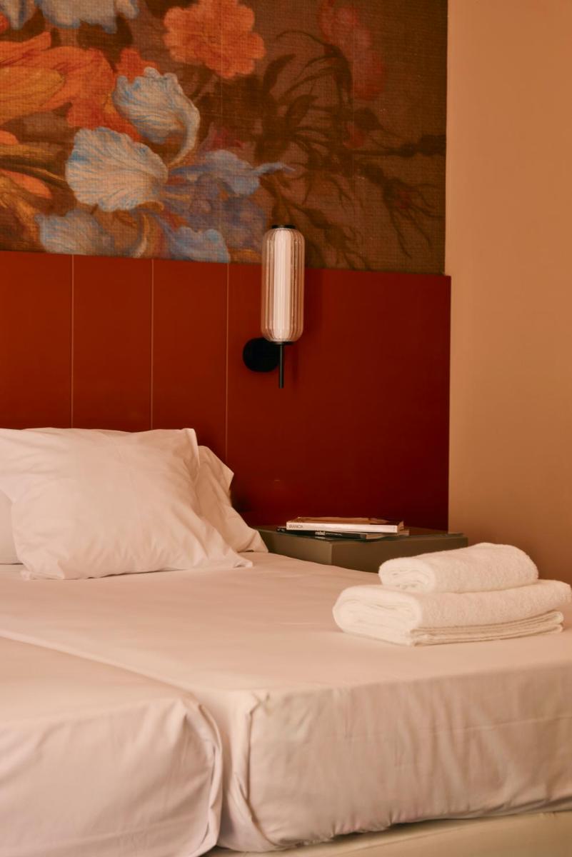 Cama o camas de una habitación en Hotel Balneario La Hermida