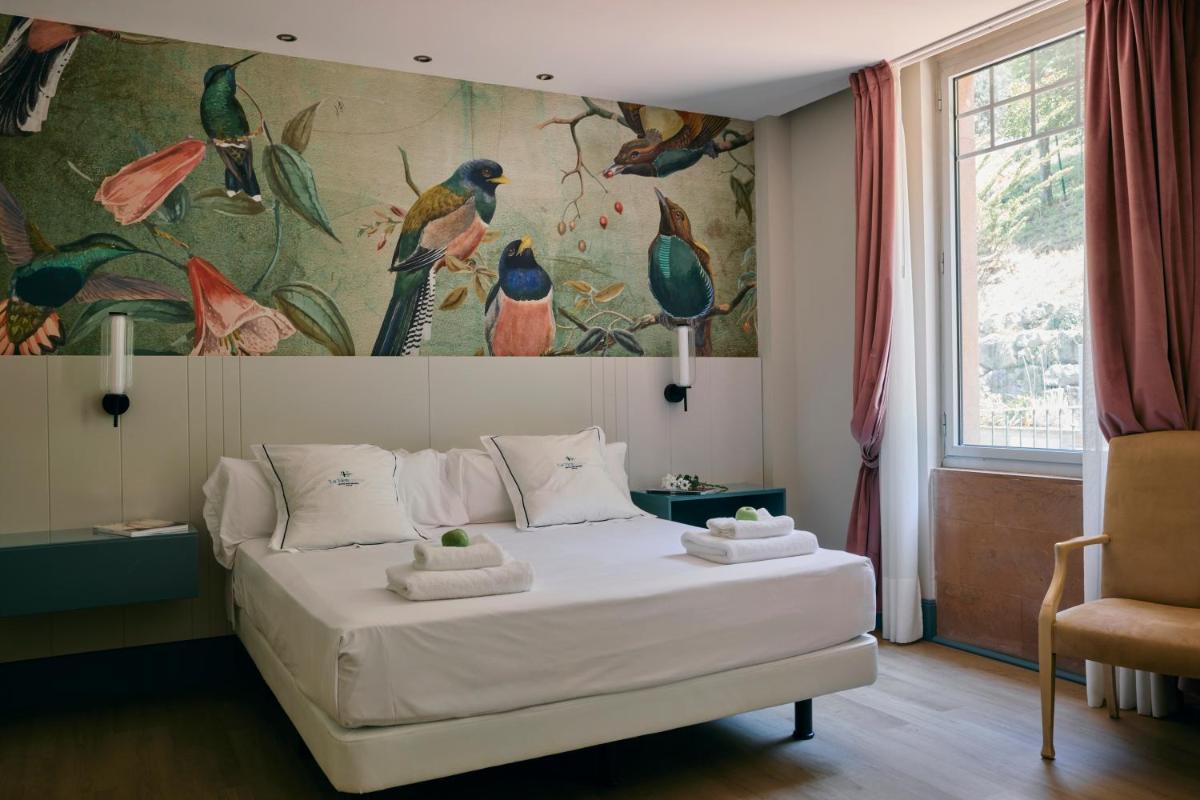 Cama o camas de una habitación en Hotel Balneario La Hermida