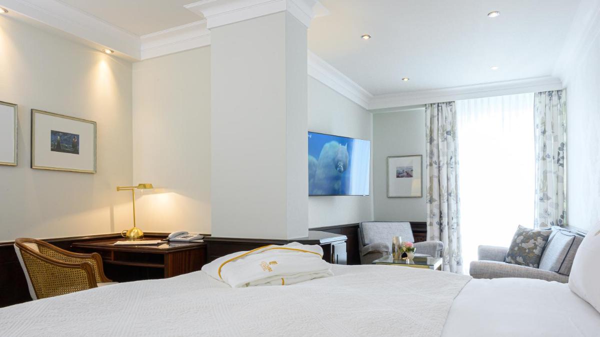 Ein Bett oder Betten in einem Zimmer der Unterkunft Colombi Hotel
