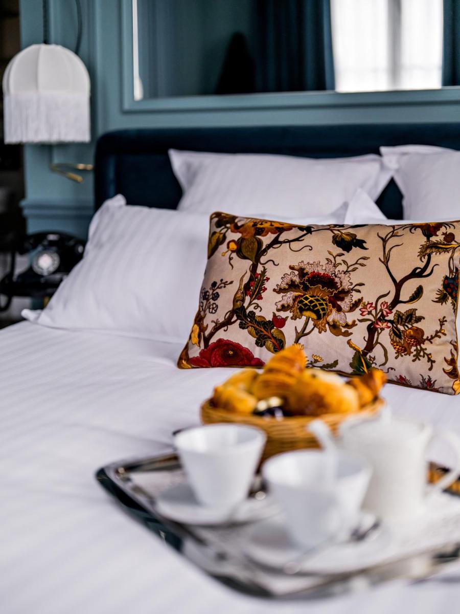 Un ou plusieurs lits dans un hébergement de l'établissement Hotel Duquesne Eiffel