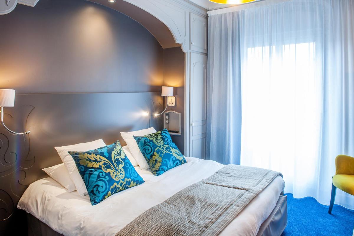 Un ou plusieurs lits dans un hébergement de l'établissement Grand Hotel Gallia & Londres