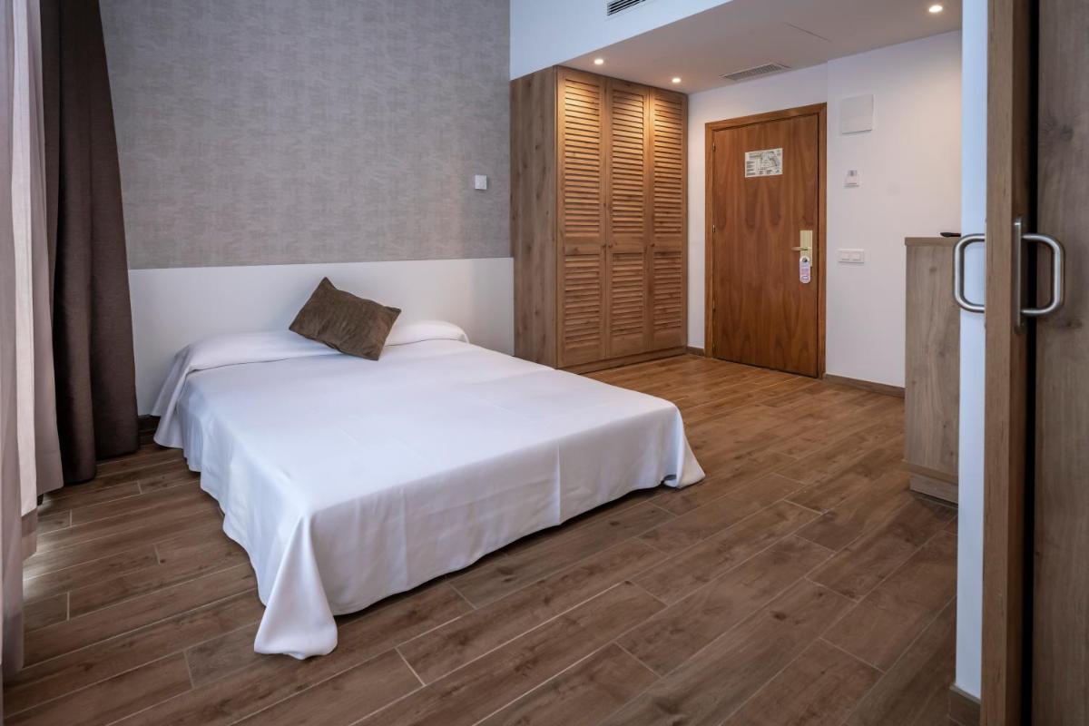 Cama o camas de una habitación en GHT Costa Brava & Spa