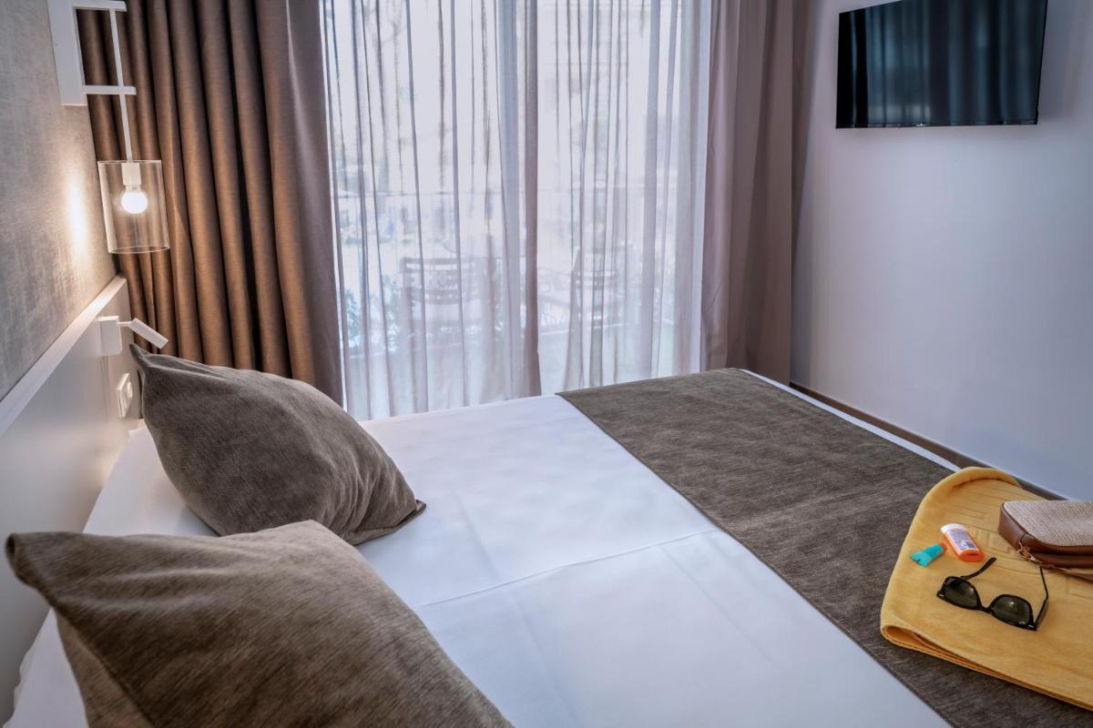 Cama o camas de una habitación en GHT Costa Brava & Spa