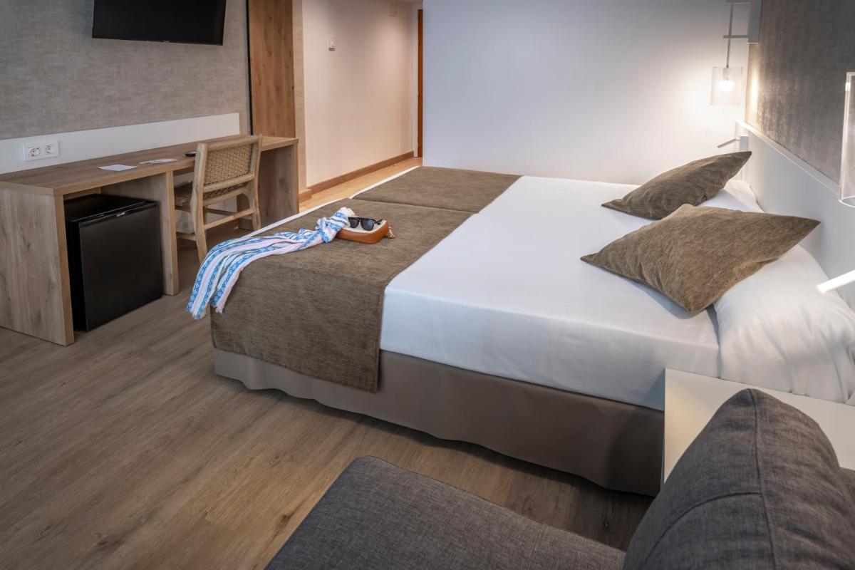 Cama o camas de una habitación en GHT Costa Brava & Spa