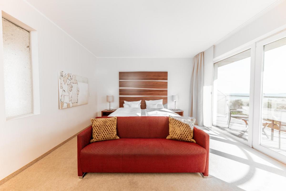 Ein Bett oder Betten in einem Zimmer der Unterkunft THE GRAND Ahrenshoop