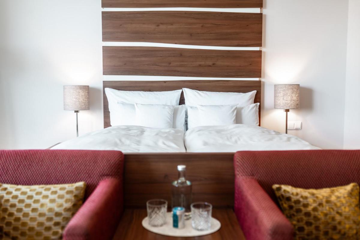 Ein Bett oder Betten in einem Zimmer der Unterkunft THE GRAND Ahrenshoop