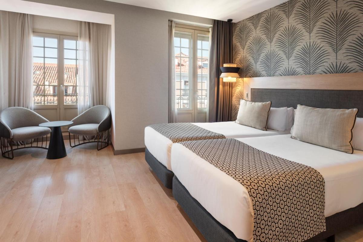 Cama o camas de una habitación en Catalonia Atocha