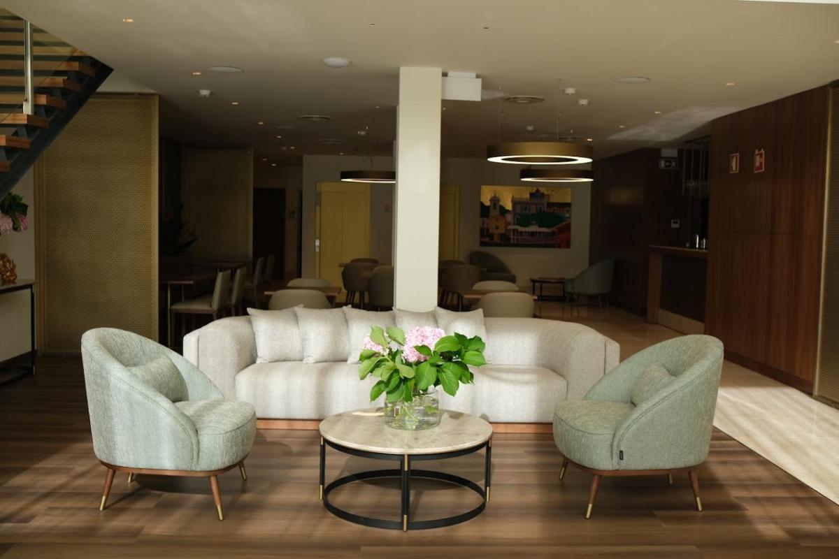 Uma área de estar em Quinta da Maquia Hotel