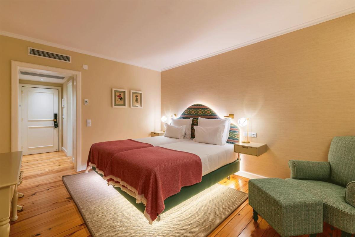 Uma cama ou camas num quarto em Pestana Quinta Perestrello