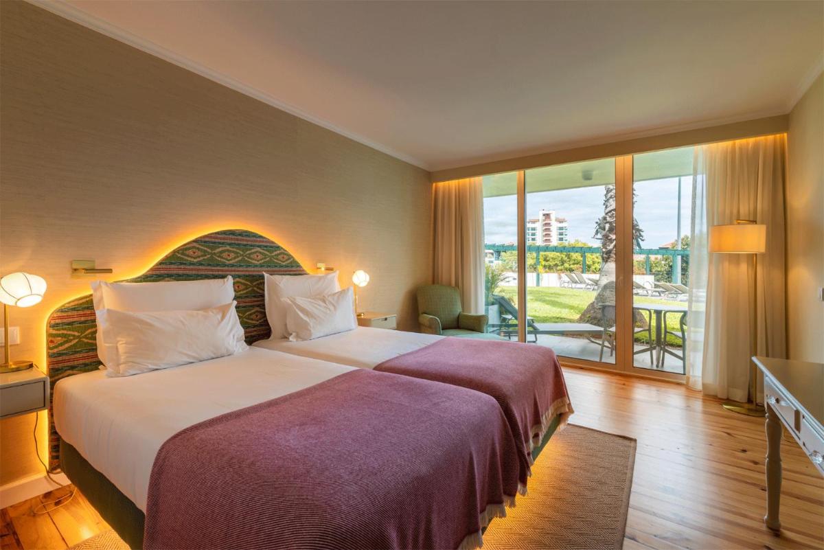 Uma cama ou camas num quarto em Pestana Quinta Perestrello