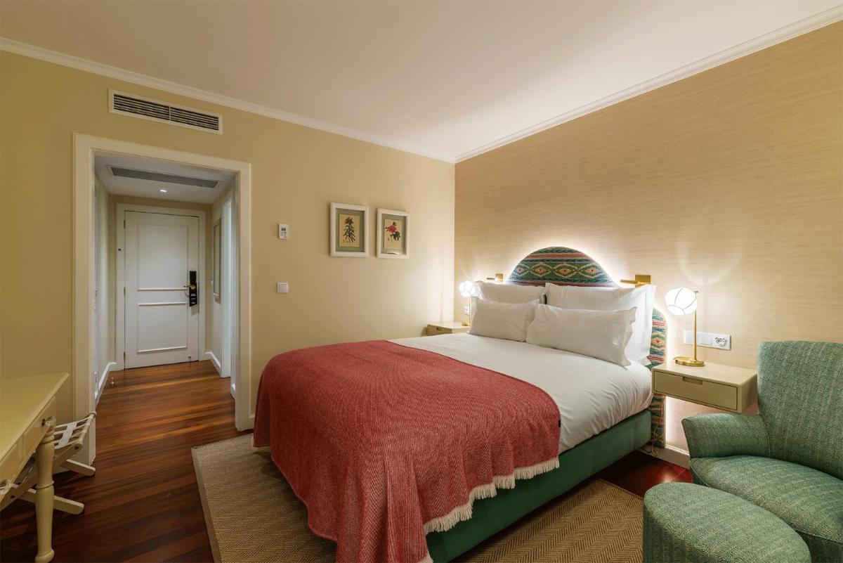 Uma cama ou camas num quarto em Pestana Quinta Perestrello