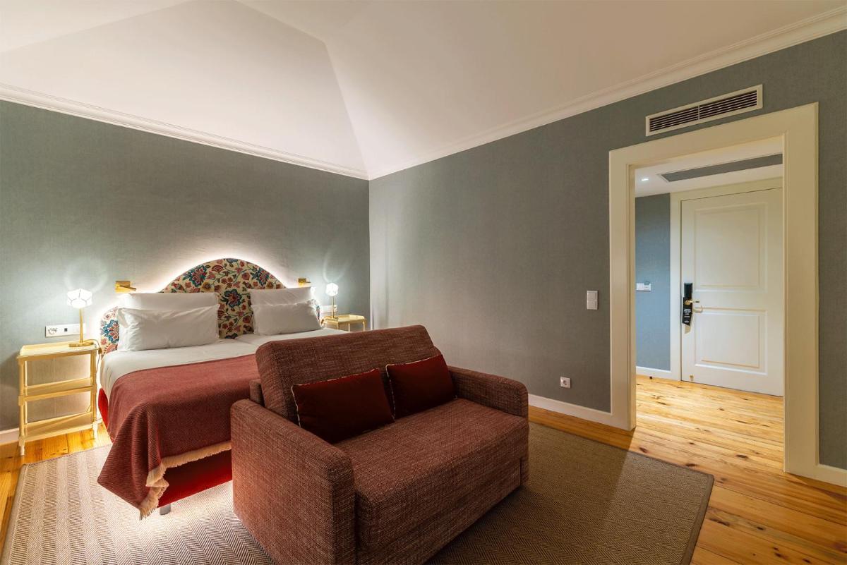 Uma cama ou camas num quarto em Pestana Quinta Perestrello
