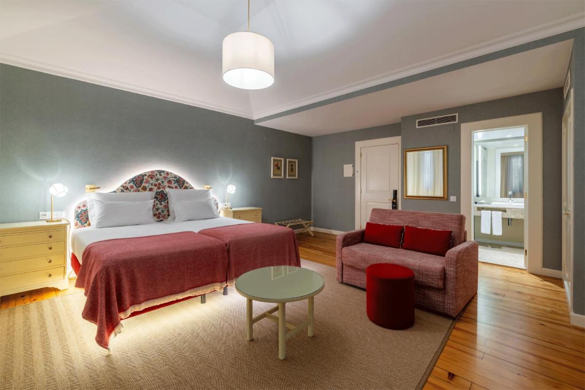 Uma cama ou camas num quarto em Pestana Quinta Perestrello