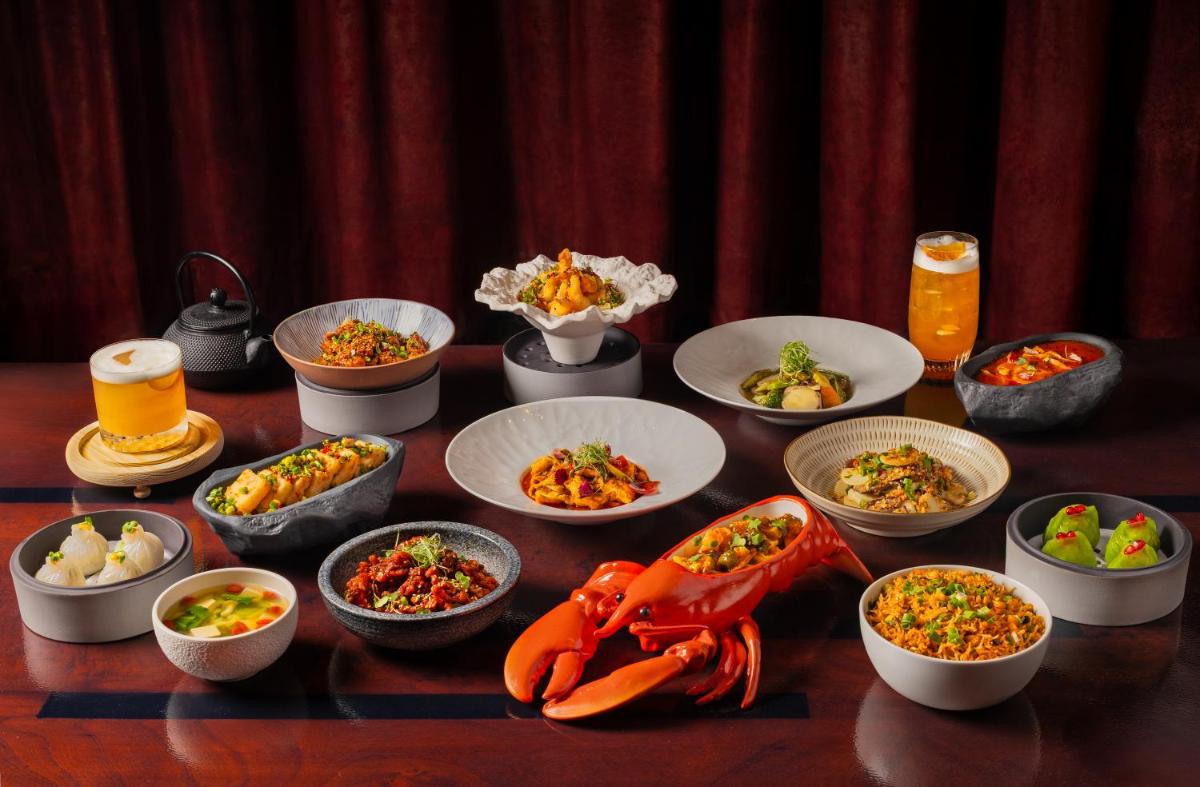 a table topped with bowls of food and bowls of food at Fairmont Mumbai in Mumbai