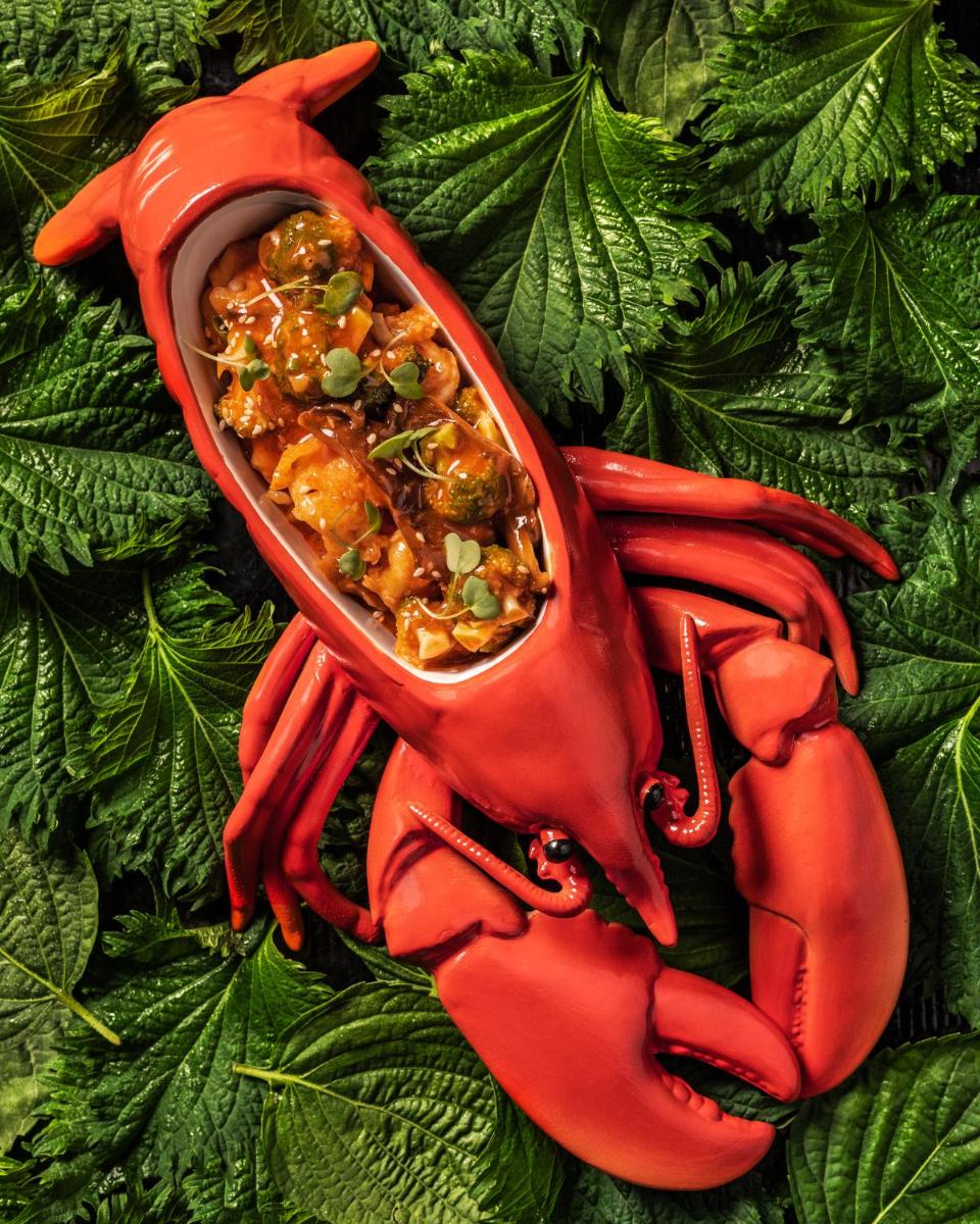 a red glove with a bowl of food in it at Fairmont Mumbai in Mumbai