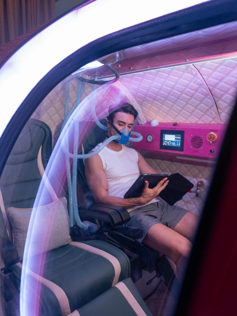 a man sitting in a car wearing a mask at Fairmont Mumbai in Mumbai