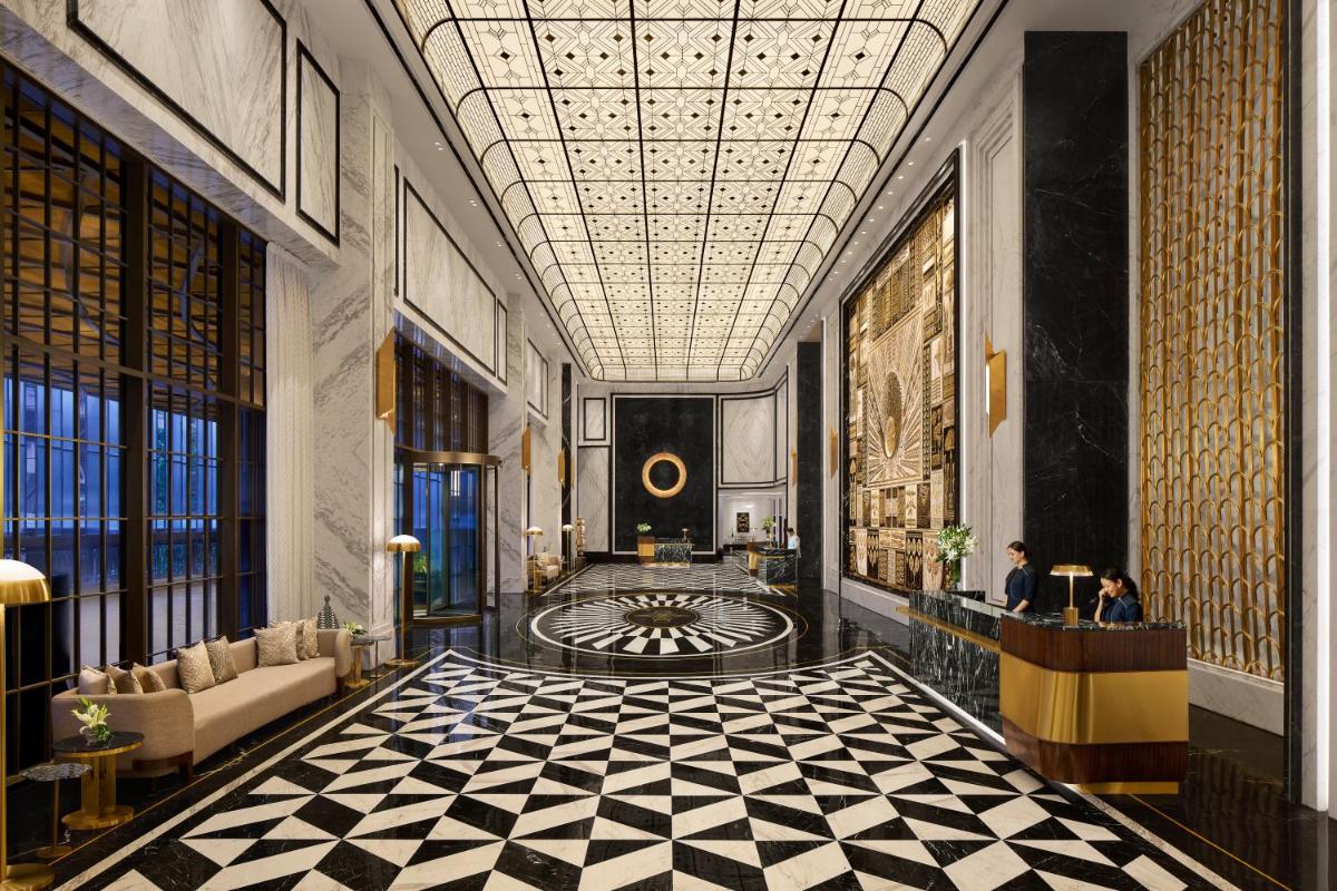 a lobby with a black and white checkered floor at Fairmont Mumbai in Mumbai