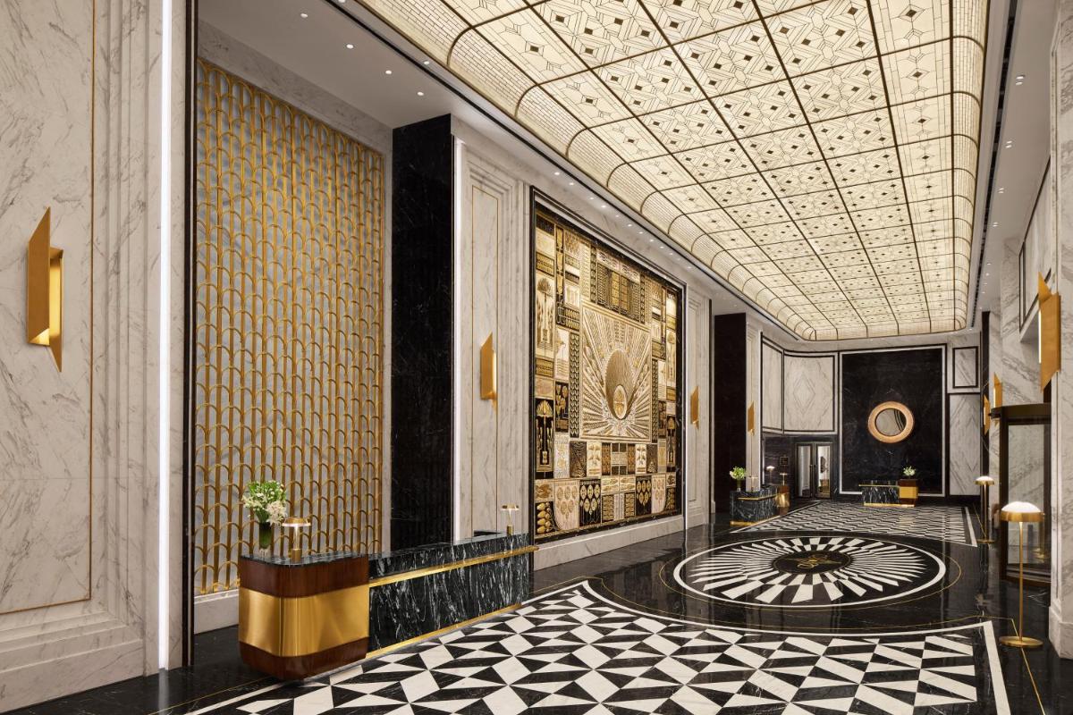 a lobby with a large mandala on the floor at Fairmont Mumbai in Mumbai