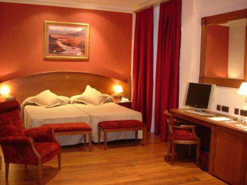 Cama o camas de una habitación en Hotel Palacio de la Magdalena