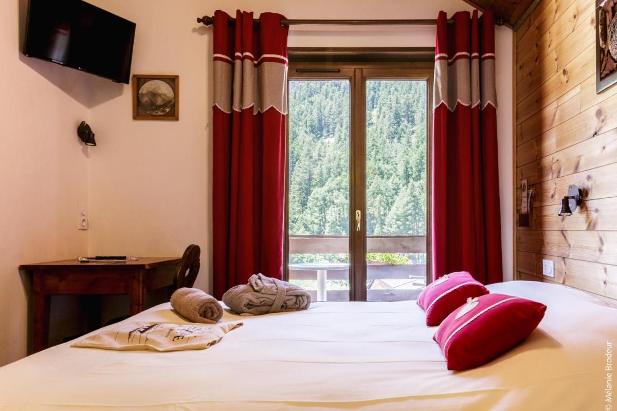 Un ou plusieurs lits dans un hébergement de l'établissement Hotel Spa L'Equipe